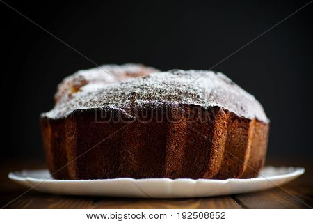 Sweet big honey cake on a white plate