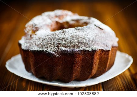 Sweet big honey cake on a white plate