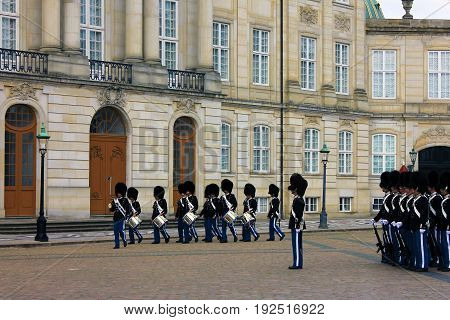 COPENHAGEN, DENMARK - APRIL 22, 2017 : Royal guardsmen in square of Royal castle Amalienborg, Copenhagen, Denmark.
