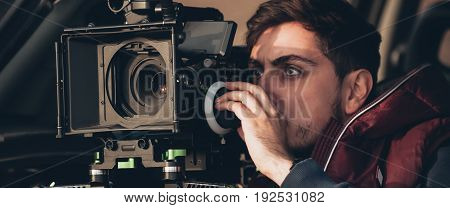 Behind The Scene. Cameraman Shooting Film Scene With His Camera