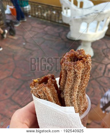 Delicious chocolate and hazelnut churros covered in sugar