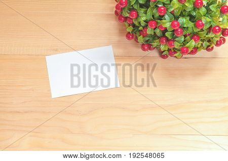 Paper note with  flowers on wood background