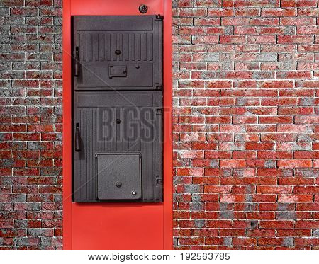 Energy savings concept. Solid fuel boiler on brick wall background