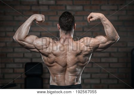 Strong Bodybuilder Man At The Gym