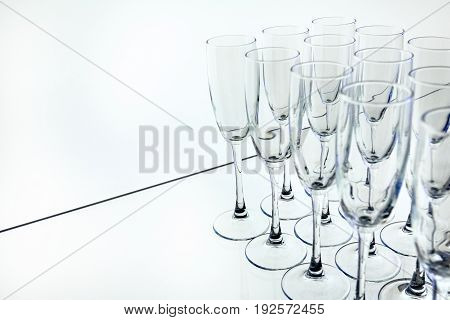 Rows of Empty Glasses on the table white background