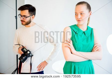 Female model working at studio. She doesn't like her pictures