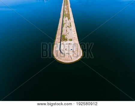 Aerial view breakwater at sea, cutwater, pier, groyne mole