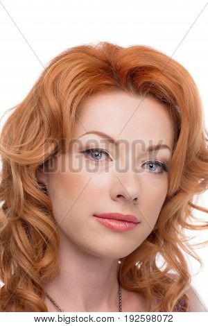 Headshot of a redhead lady looking forward