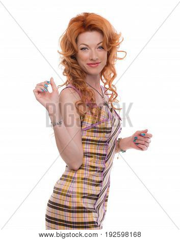 Upper half of a smiling redhead standing sideways.