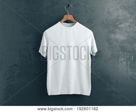 Wooden hanger with empty white t-shirt hanging on dark concrete background. Retail concept. Mock up. 3D Rendering