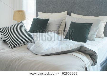 Messy Bed With Pillows In Modern Interior  Bedroom