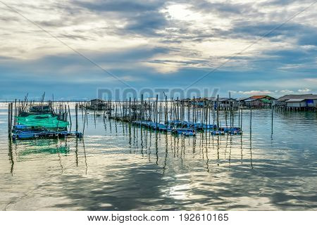 Homestay and floating basket in lake at Kohyo Songkhla Thailand with beautiful sky and clouds. This is traditional fisheries area.
