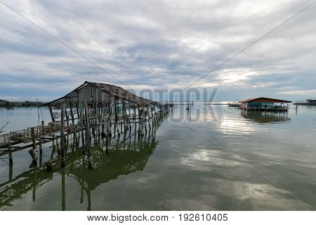 Homestay and floating basket in lake at Kohyo Songkhla Thailand with beautiful sky and clouds. This is traditional fisheries area.