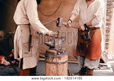 Blacksmiths work as forging forging on metal. The concept of making products from iron.