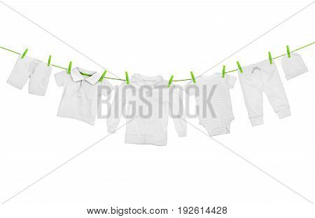 Laundry line with light clothes isolated on white background