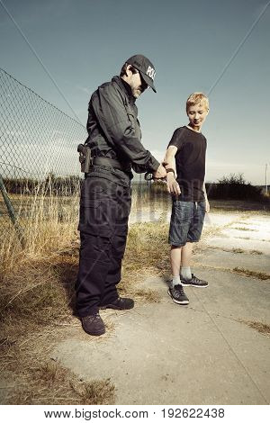 Teenager taken to handcuffs by police man