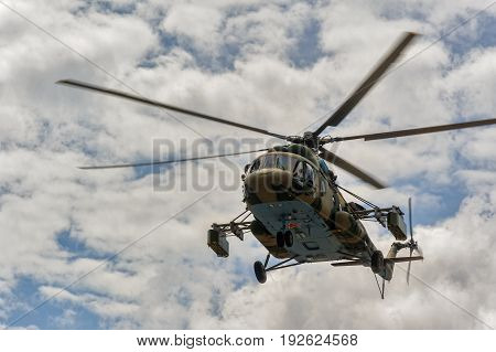 Russian Military Helicopter Mi-8 In The Cloudy Sky