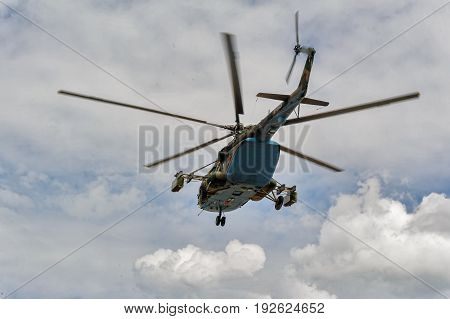 Russian Military Helicopter Mi-8 In The Cloudy Sky