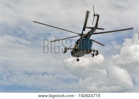 Russian Military Helicopter Mi-8 In The Cloudy Sky