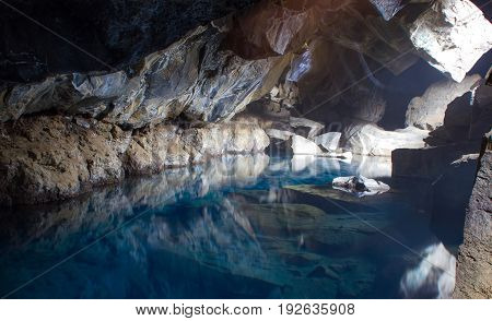 Azure water in hot termal cave, Iceland