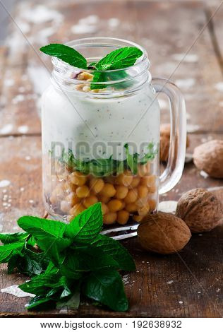 minty yogurt parfaits in the jar.style rustic.selective focus