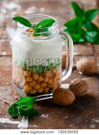 minty yogurt parfaits in the jar.style rustic.selective focus