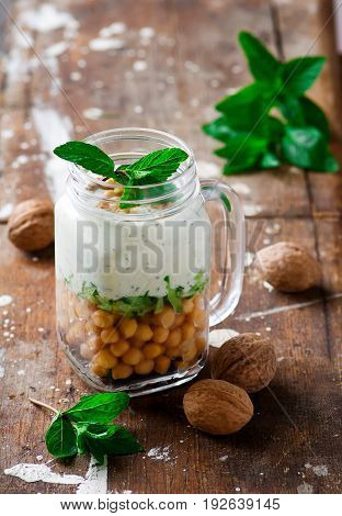 minty yogurt parfaits in the jar.style rustic.selective focus