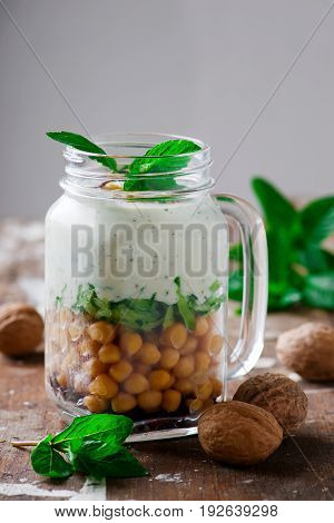 minty yogurt parfaits in the jar.style rustic.selective focus