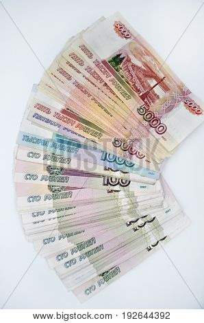 a lot of 5000 1000 1000 banknotes of Bank of Russia on white background Russian rubles spine 100 banknotes of five thousand rubles