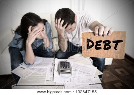 young couple worried need help in stress at home living room couch accounting debt bills bank papers expenses and payments feeling desperate in bad financial situation and bankruptcy
