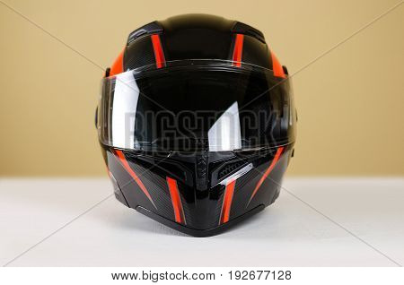 Beautiful Black With Red Motorcycle Helmet. With A Transparent Visor. Closeup. Isolated