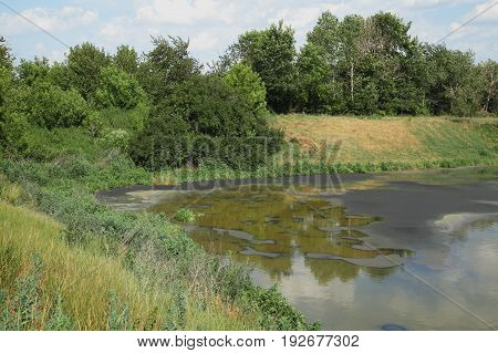 Drying feces into fertilizer. Lake for drying sewage. Drain faeces. Septic tank with sewage. Dirty waste water in sewage plant. The drain in the industry.