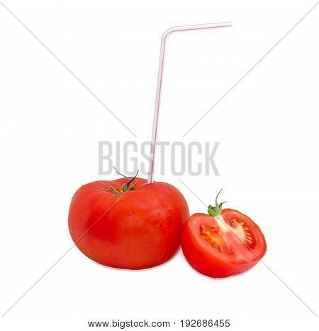Big fresh ripe tomato and bendable drinking straw inserted into it and half of other tomato on a light background