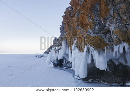 Icicles In Oltrek Island Rock. Lake Baikal Winter Landscape
