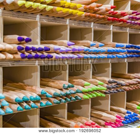 Wooden colored pencils on a shelf Colored Pencil Tips Colorful Spectrum Shelf Background Stacks Groups Rainbow