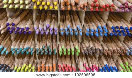 Wooden colored pencils on a shelf Colored Pencil Tips Colorful Spectrum Shelf Background Stacks Groups Rainbow
