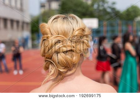 Modern haistyle hairdo of a girl at prom graduation