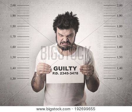 Caught guilty man with ID signs on his hand.
