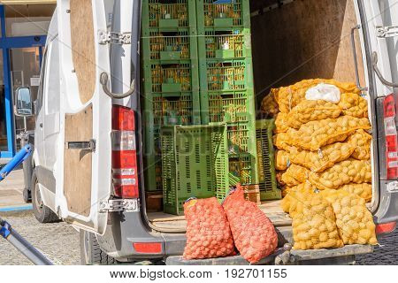 Organic vegetables are brought to the weekly farmers market - vans