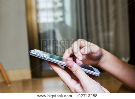 Hand Hold Smartphone Or Moblie Phone Playing Game Or Serfing