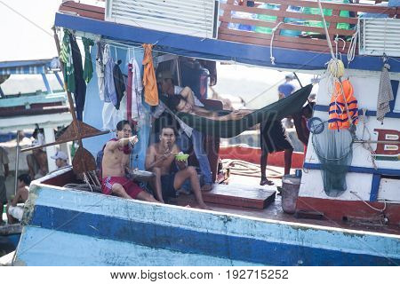 PHU QUOC, VIETNAM - March 21, 2017: Lifestyle of fishermen on their boats in An Thoi pier village, Phu Quoc island, Vietnam