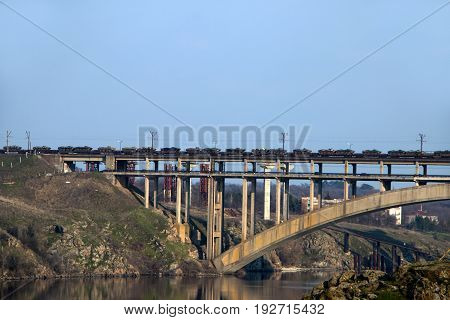 Military tanks are moving along the bridge over the Dnieper River in Zaporozhye