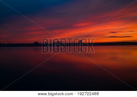 Orange And Red Sunset At Coast Of The Lake
