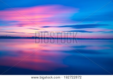 Orange And Red Sunset At Coast Of The Lake