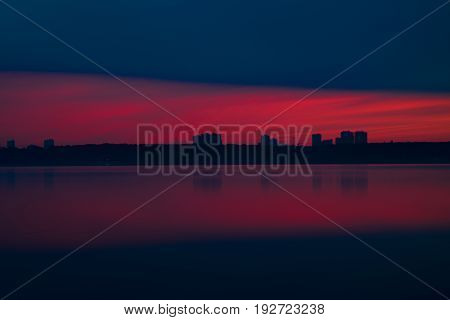 Orange And Red Sunset At Coast Of The Lake