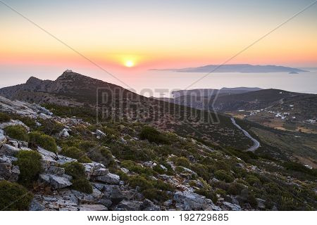 Sunset over mountains near Kamares village on Sifnos island, Greece.