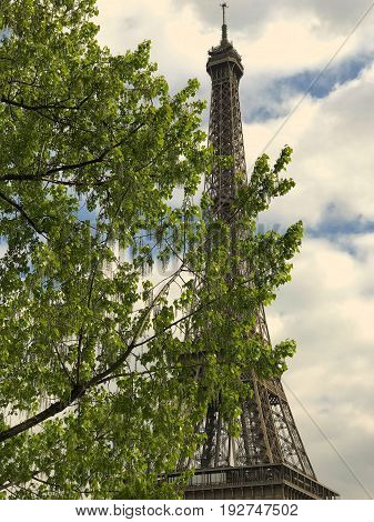 Majestic and imposing tower eifel under the clouds of a warm spring