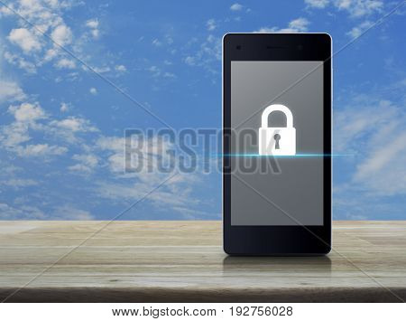 Key icon on modern smart phone screen on wooden table over blue sky with white clouds Business internet security concept