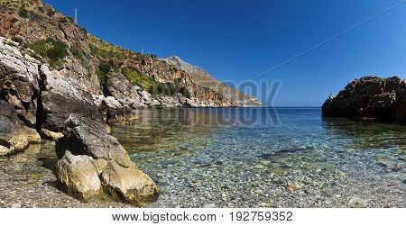A small pebbles beach Lo Zingaro Nature Reserve in Sicily Italy