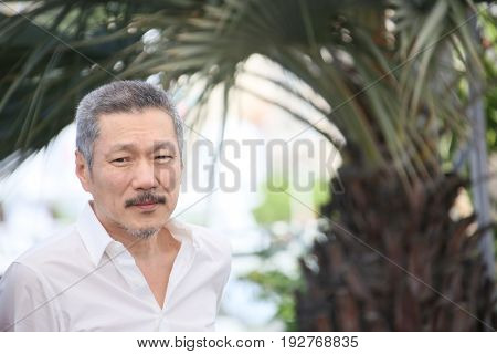 Hong SangSoo attends the 'Claire's Camera (Keul-Le-Eo-Ui-Ka-Me-La)' Photocall during the 70th annual Cannes Film Festival at Palais des Festivals on May 21, 2017 in Cannes, France. 